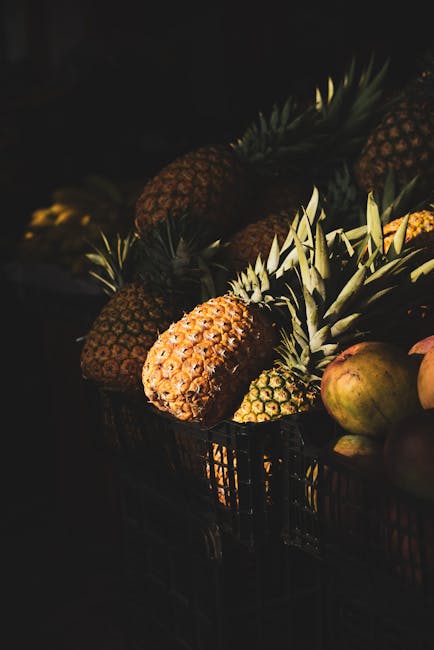 A happy shopper with a pineapple in hand, smiling while checking its aroma